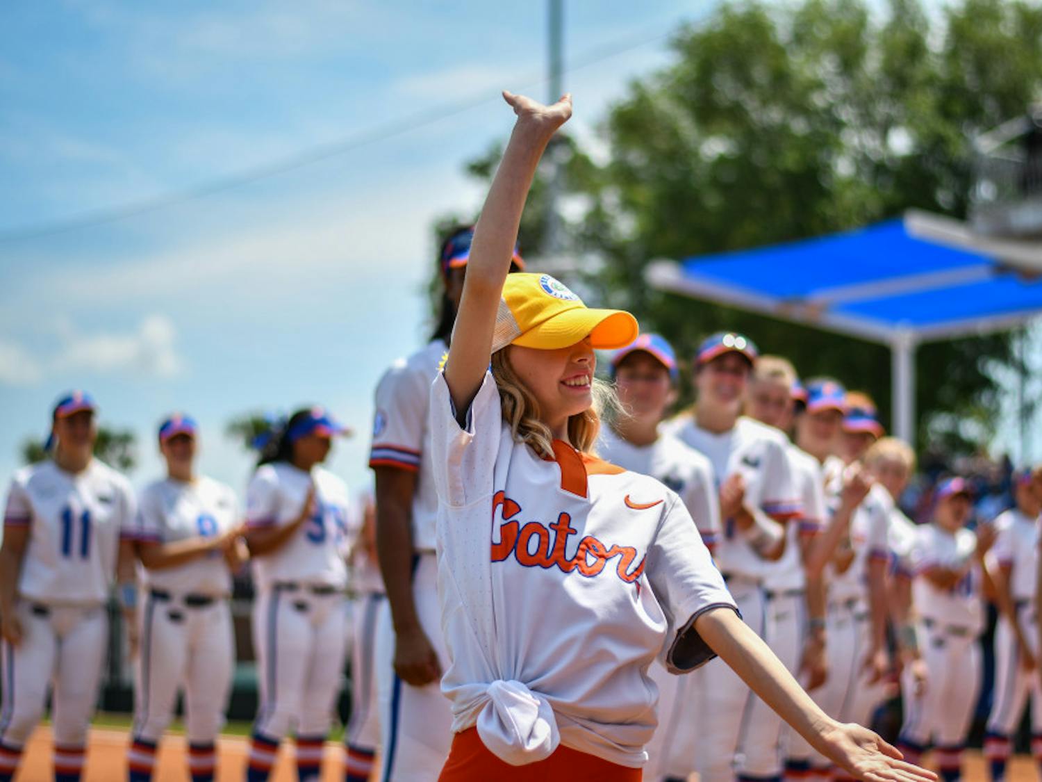 Hartley Georges is introduced with the UF softball team during its game against Arkansas on April 7. Georges has been an honorary member of the team since November.