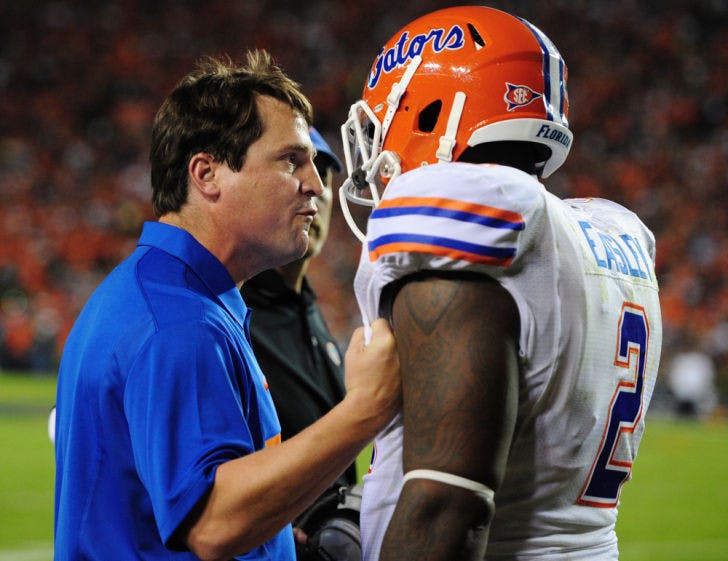 Will Muschamp speaks with senior defensive tackle Dominique Easley during Florida’s 17-6 loss to Auburn on Oct. 15, 2011, at Jordan-Hare Stadium. Easley recorded a team-leading four sacks in 2012.