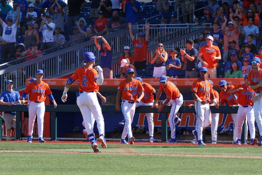 Florida right fielder Ty Evans flips his bat after he hit a home run in the Gators' 14-4 win over the Miami Hurricanes Sunday, March 5, 2023.