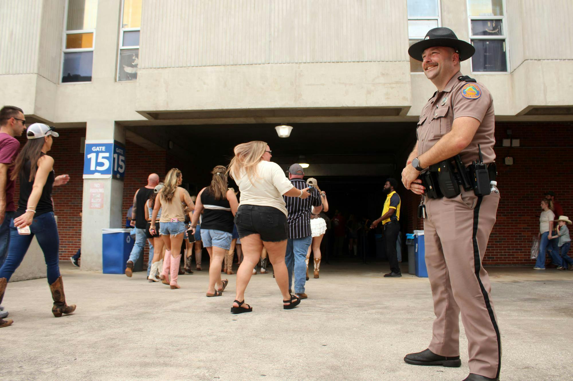 Trooper David Hughes watched crowd walking towards ticket check in for the Morgan Wallen Concert at the Ben Hill Griffin Stadium in Gainesville, Fla. on Saturday,  May 16, 2026 (Photo by Riana Morales)