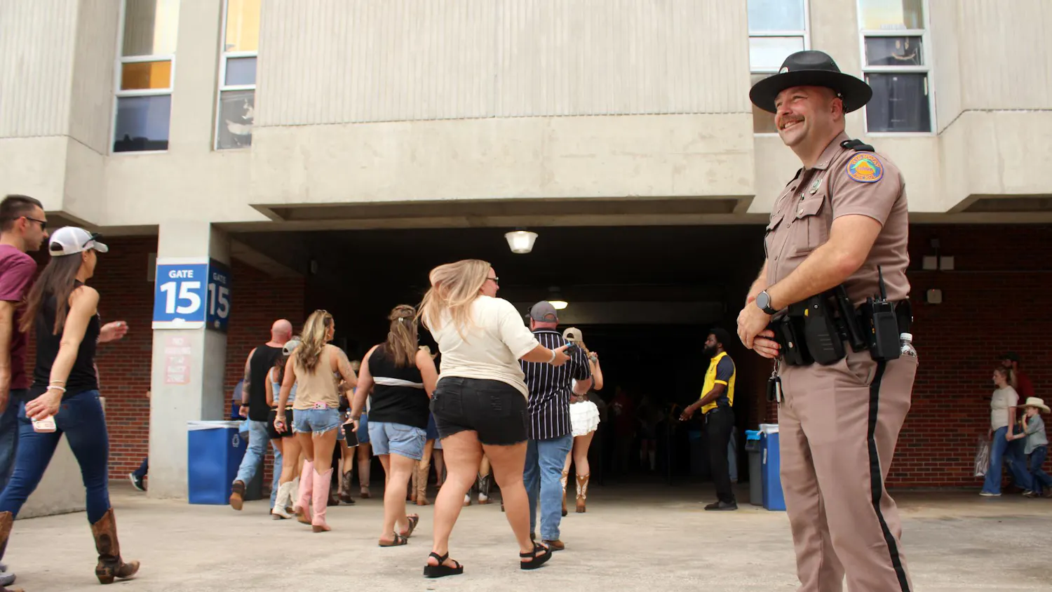 Trooper David Hughes watched crowd walking towards ticket check in for the Morgan Wallen Concert at the Ben Hill Griffin Stadium in Gainesville, Fla. on Saturday, May 16, 2026 (Photo by Riana Morales)