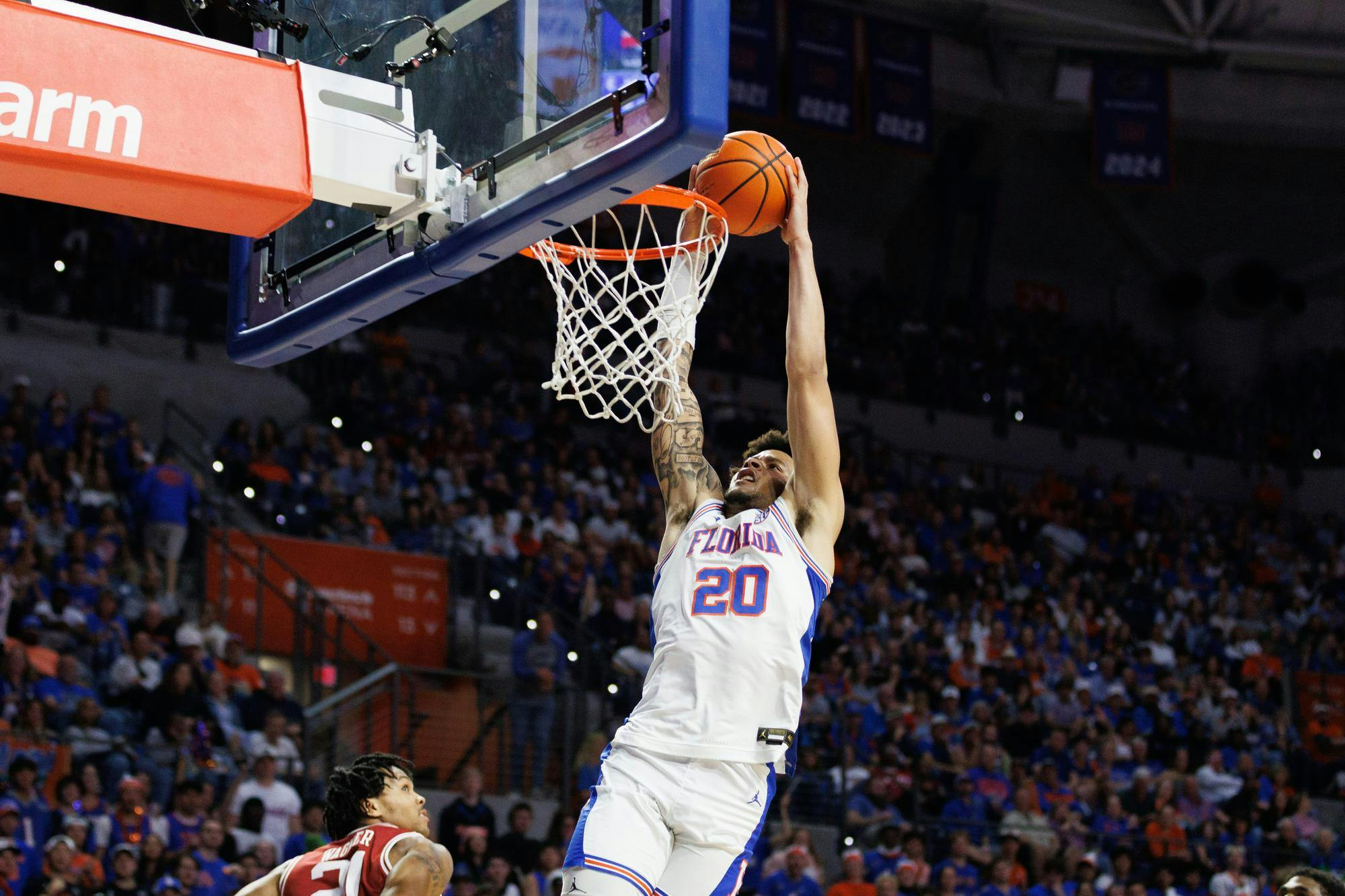 Florida guard Isaiah Brown (20) dunks the ball during the first half of an NCAA basketball game against Arkansas, Saturday, Feb.28, 2026, in Gainesville, Fla.