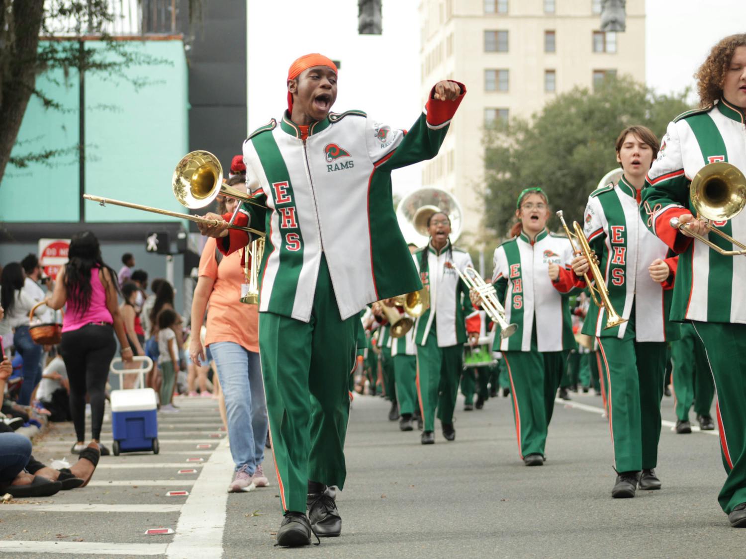 An Eastside High School marching band member chants along with other performers at the City of Gainesville Holiday Parade on Saturday, Dec. 2, 2023