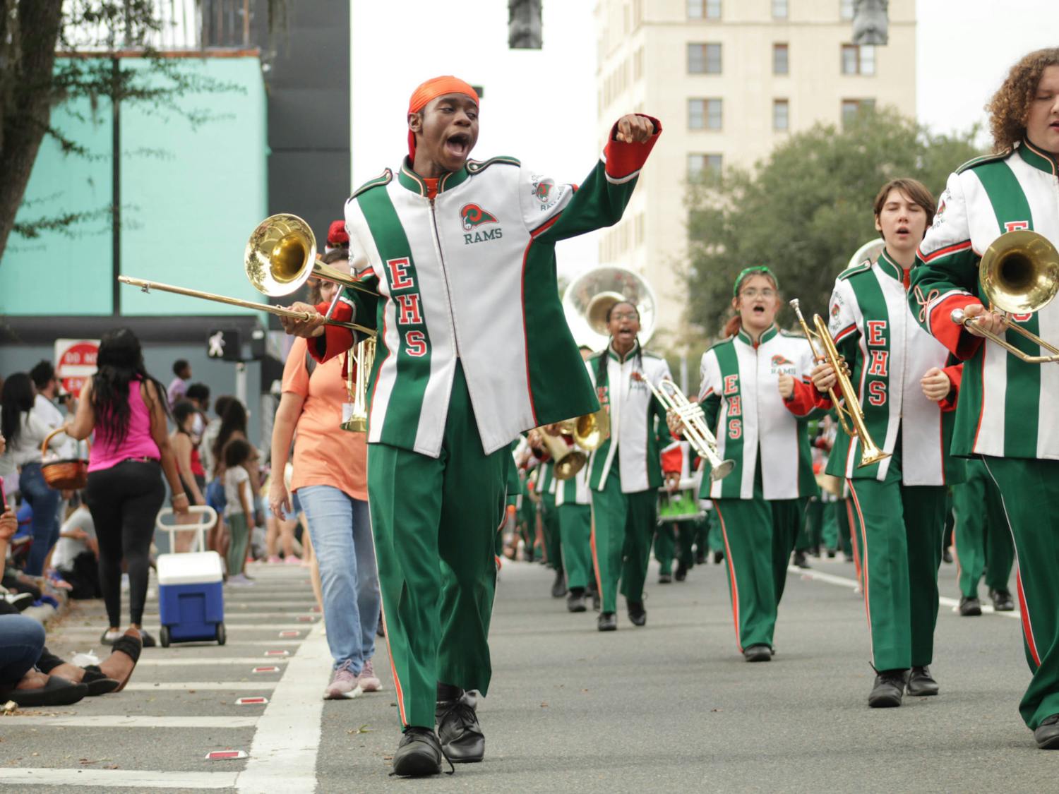  An Eastside High School marching band member chants along with other performers at the City of Gainesville Holiday Parade on Saturday, Dec. 2, 2023
