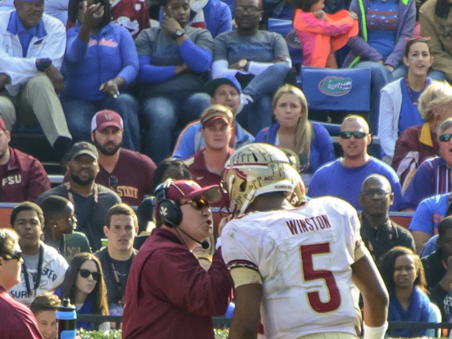 Florida State coach Jimbo Fisher talks to quarterback Jameis Winston (5) during FSU's 37-7 win against UF on Nov. 30 at Ben Hill Griffin Stadium.