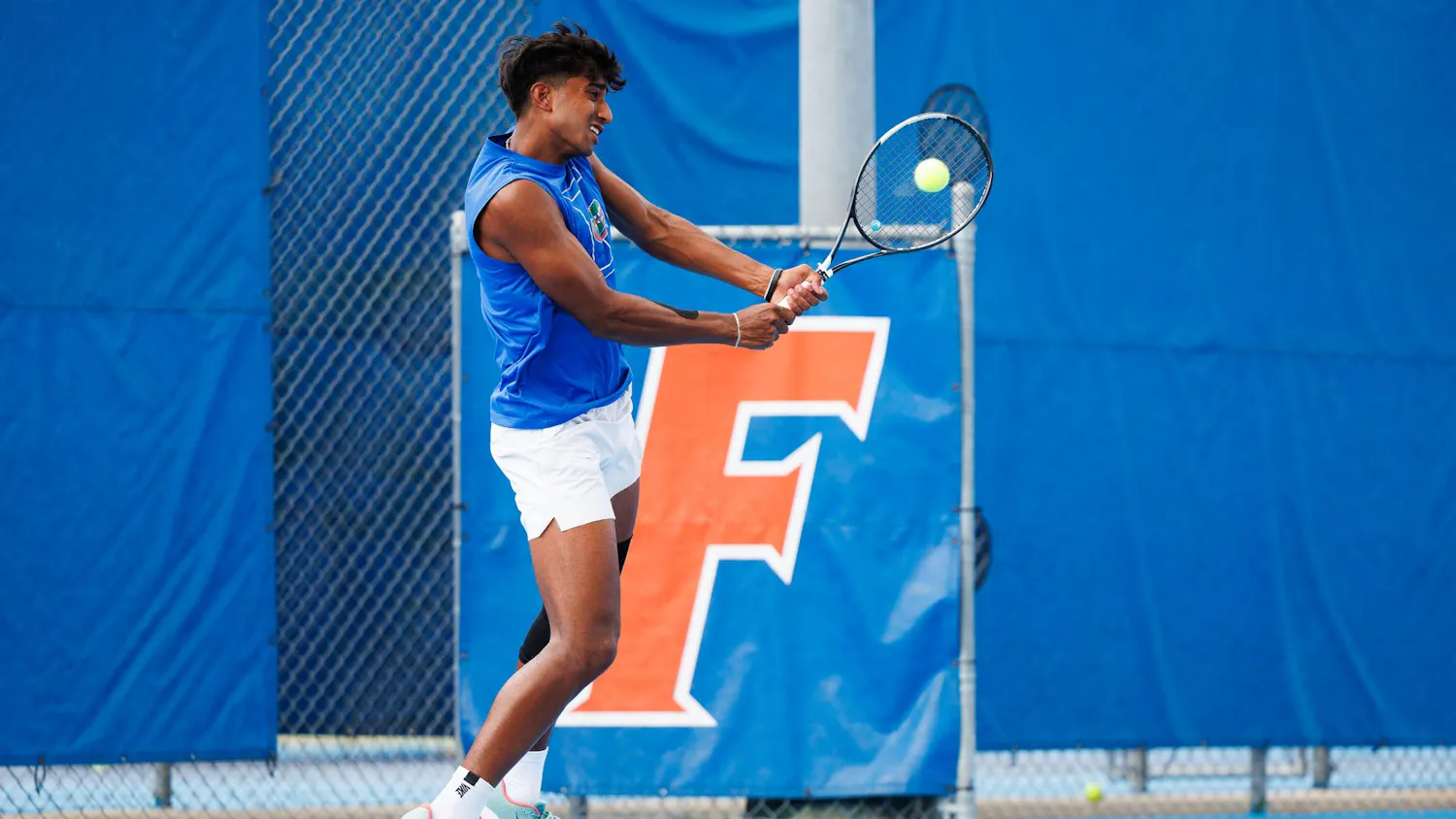 Florida tennis player Adhithya Ganesan returns a serve during an NCAA tennis match against Vanderbilt, Thursday, April 2, 2026, in Gainesville, Fla.