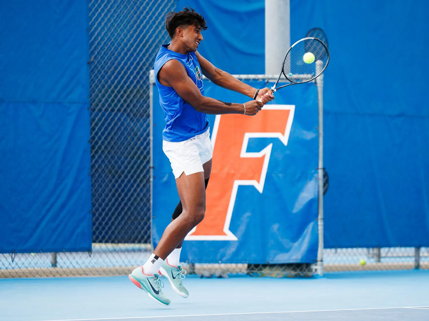 Florida tennis player Adhithya Ganesan returns a serve during an NCAA tennis match against Vanderbilt, Thursday, April 2, 2026, in Gainesville, Fla.
