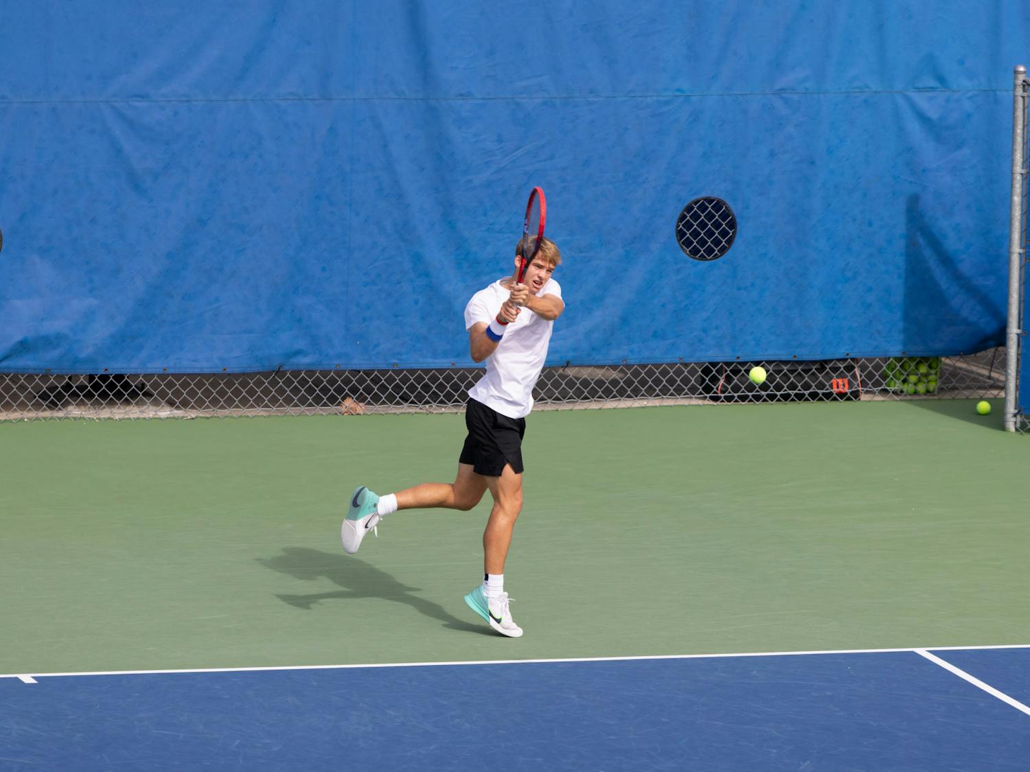 Gators men's tennis freshman Kevin Edengren hits a backhand shot in the team's match against The Citadel on Friday, January 19, 2024. 
