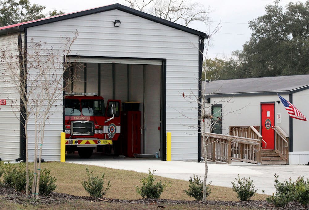 A fire engine sits under a newly constructed shed at the Alachua County Fire Rescue Station 25 on Tuesday, Jan. 26, 2021. The station didn’t have an enclosed space for the engine and was not recognized as a fire station when it opened last January, despite being on call and operating as one.