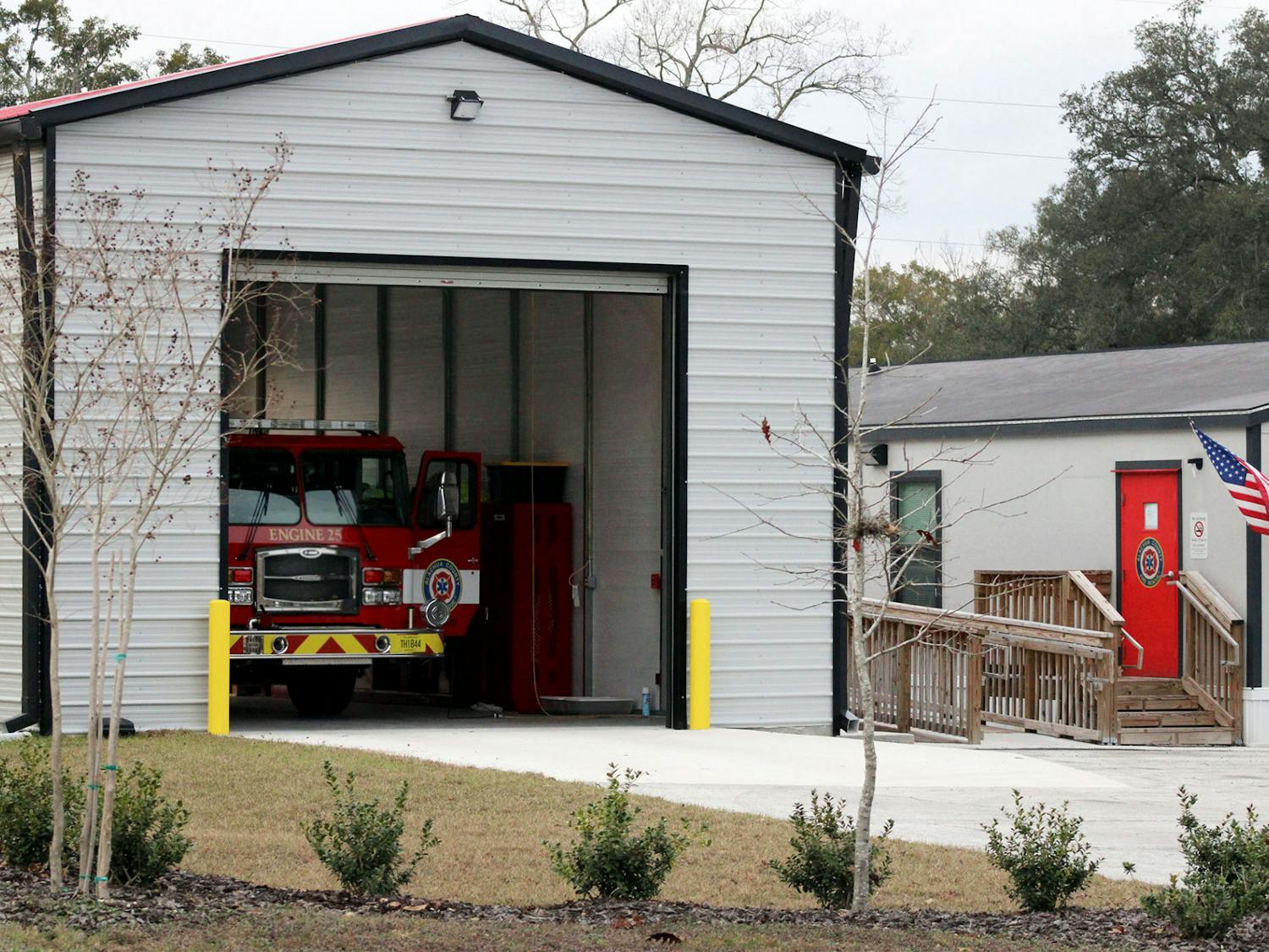 A fire engine sits under a newly constructed shed at the Alachua County Fire Rescue Station 25 on Tuesday, Jan. 26, 2021. The station didn’t have an enclosed space for the engine and was not recognized as a fire station when it opened last January, despite being on call and operating as one.