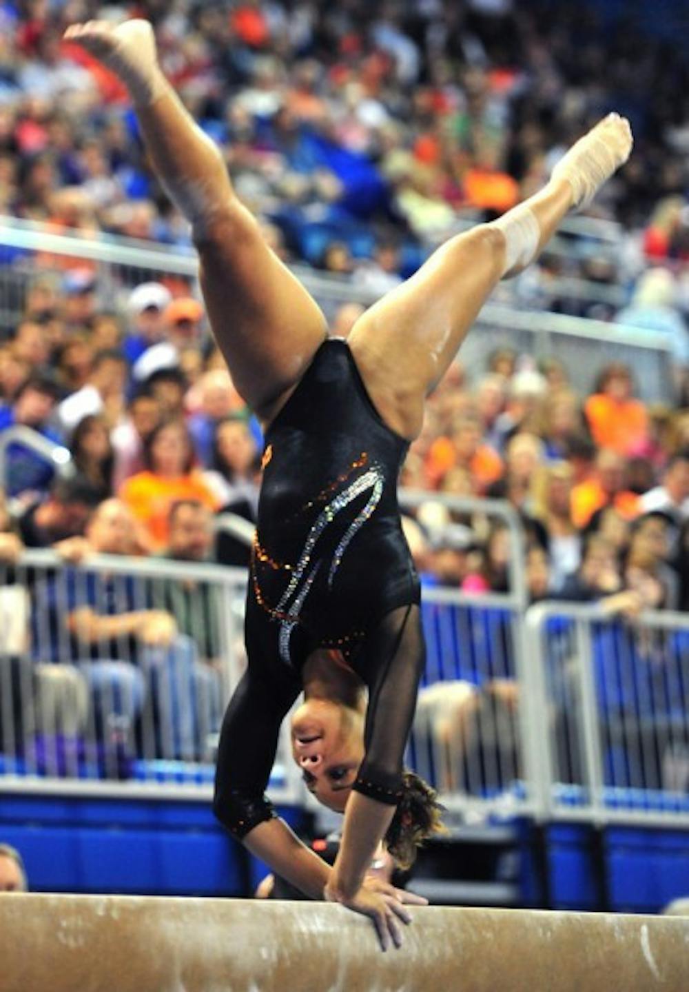 <p>Florida sophomore gymnast Kytra Hunter works on the balance beam during a meet last season. Hunter matched a career-best of 9.90 on the uneven bars against Ball State on Friday at the Stephen C. O'Connell Center. Florida recorded its third-highest team score ever in season openers.</p>