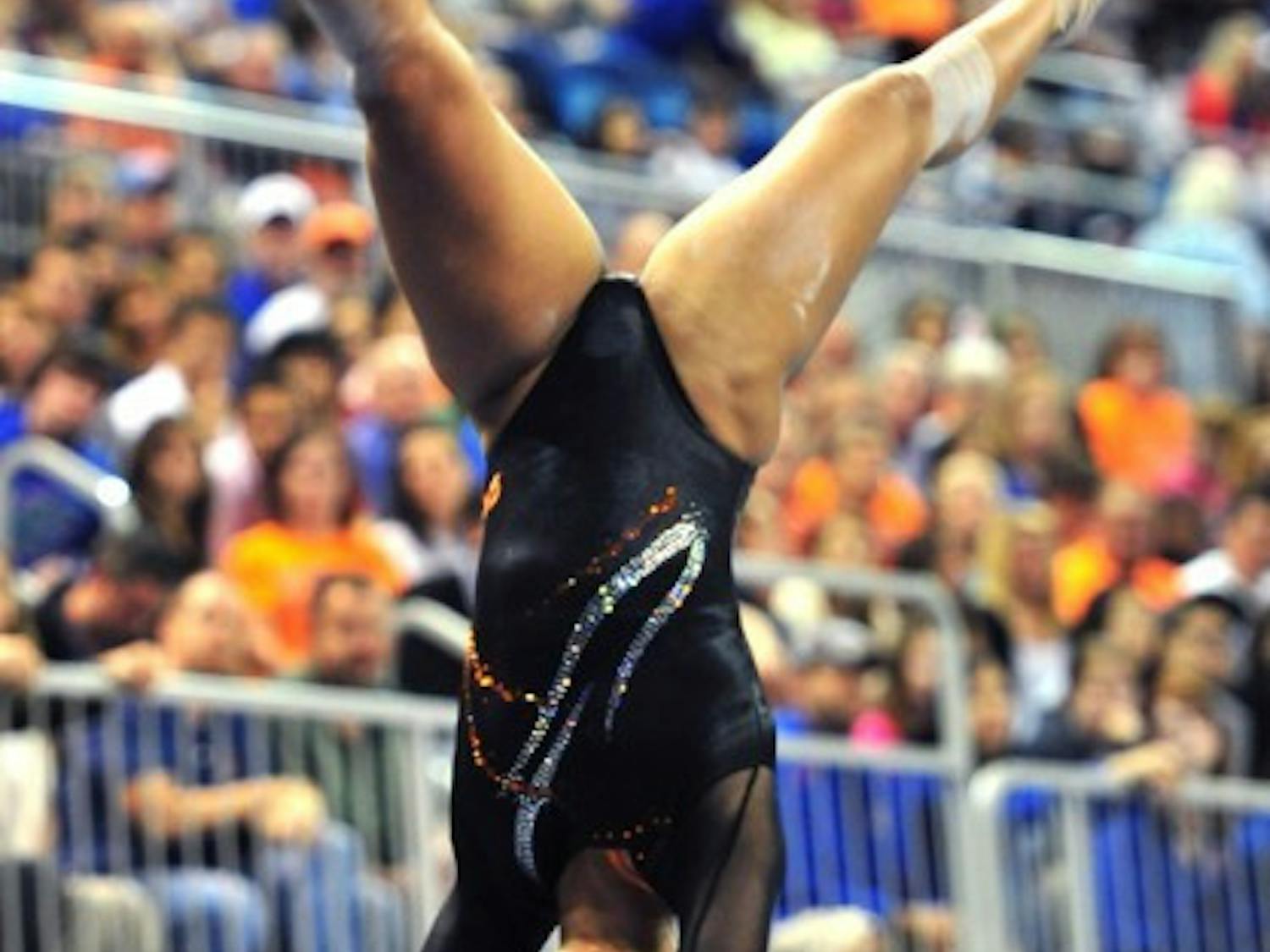Florida sophomore gymnast Kytra Hunter works on the balance beam during a meet last season. Hunter matched a career-best of 9.90 on the uneven bars against Ball State on Friday at the Stephen C. O'Connell Center. Florida recorded its third-highest team score ever in season openers.