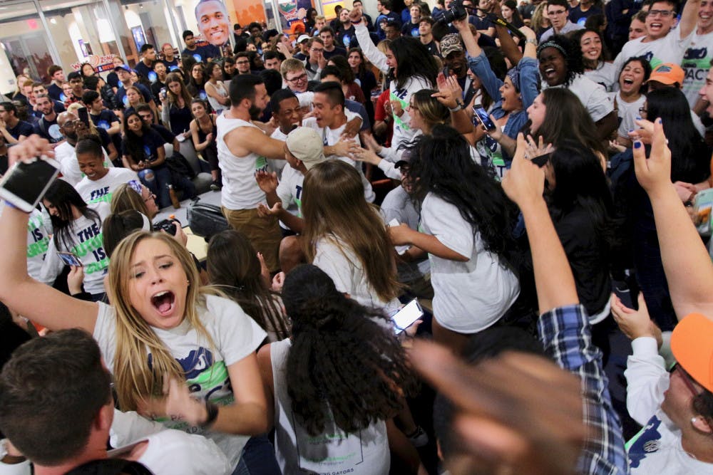 Members of the Impact Party cheer after hearing the results of the 2018 Spring Student Government election. Impact Party swept the execute ticket and claimed a majority of the 50 Student Senate seats. 