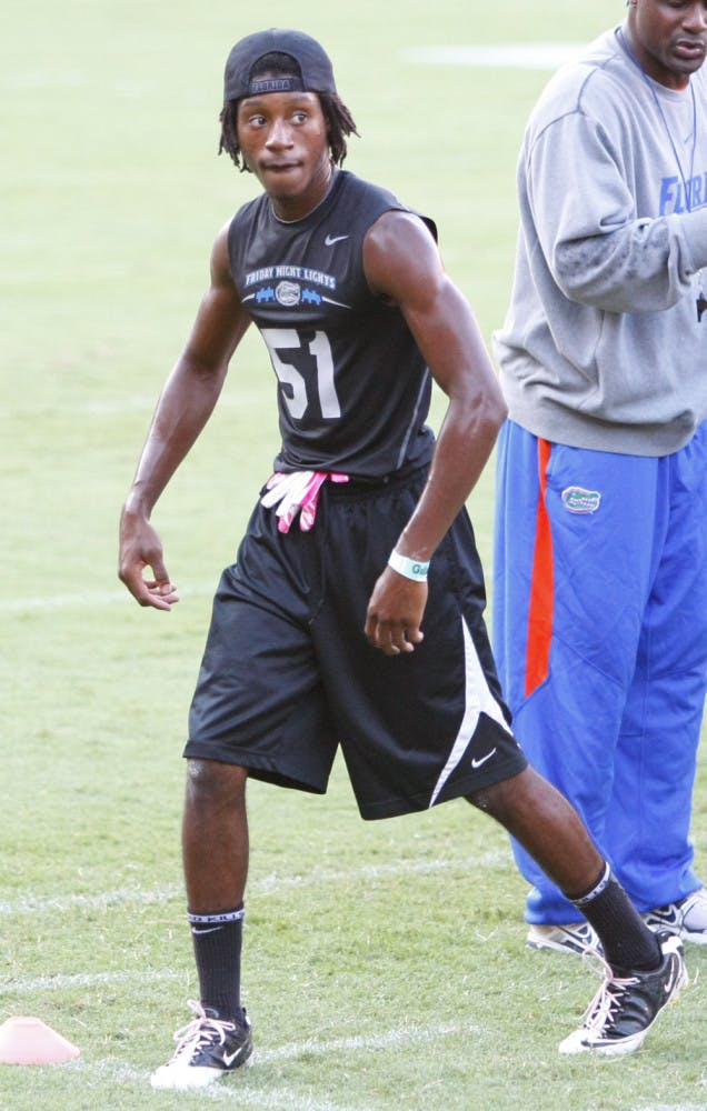 Chris Thompson waits to run drills during Friday Night Lights a Ben Hill Griffin Stadium.