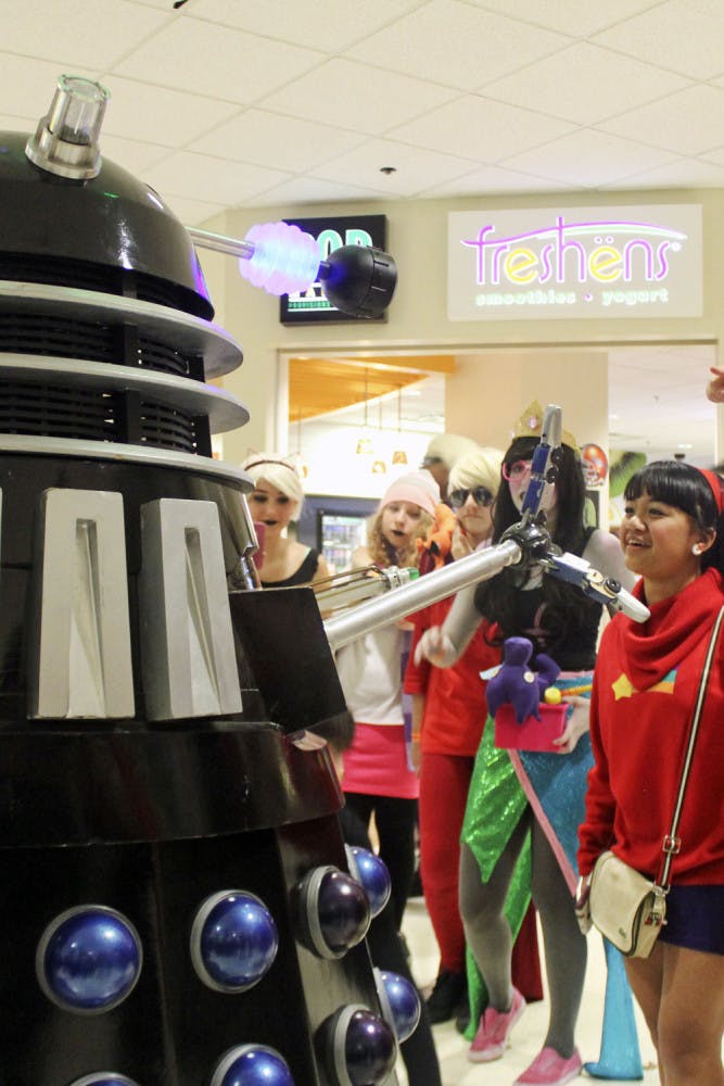 A Dalek, a creature from the British television program Doctor Who, roams through the Reitz Union on Saturday during SwampCon. The convention was attended by people dressed up as characters from different fictional series.
