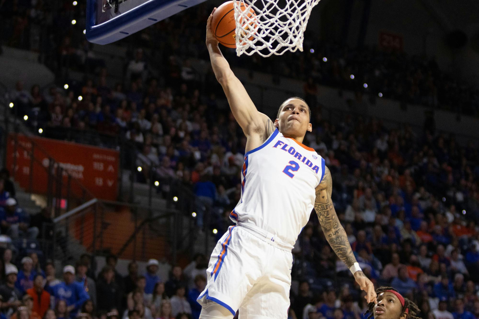 Gators sophomore guard Riley Kugel goes up for a dunk in the team's win over the Arkansas Razorbacks on Saturday, January 13, 2024. 
