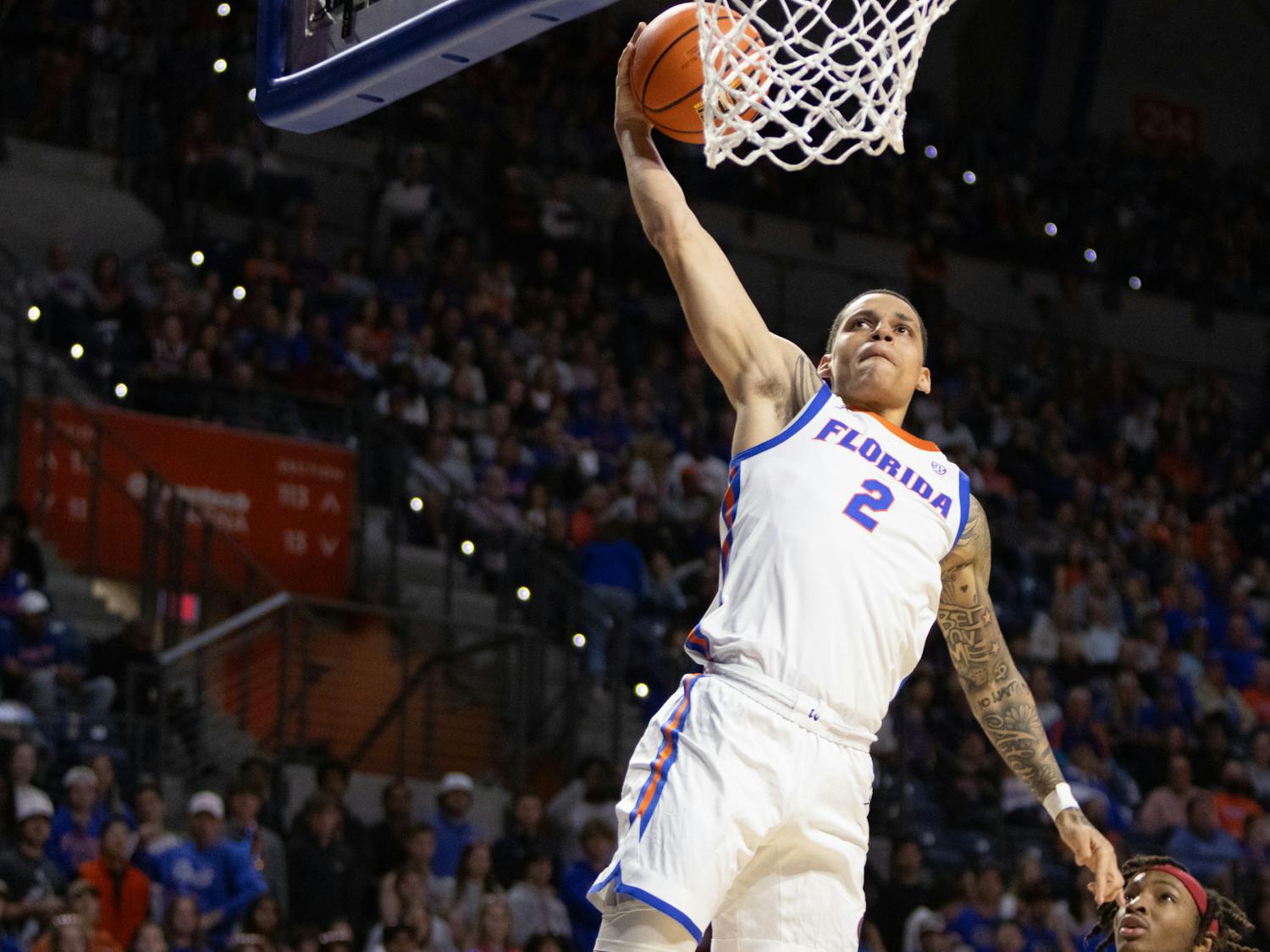 Gators sophomore guard Riley Kugel goes up for a dunk in the team's win over the Arkansas Razorbacks on Saturday, January 13, 2024.