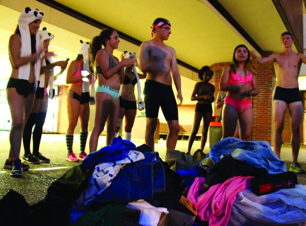 Mackenzie Conol, 21, addresses a crowd of about 35 people before running the Great Underwear Dash Spring 2017. The goal of the event is to collect clothes for donation to the St. Francis House in Gainesville, located at 413 S. Main St.