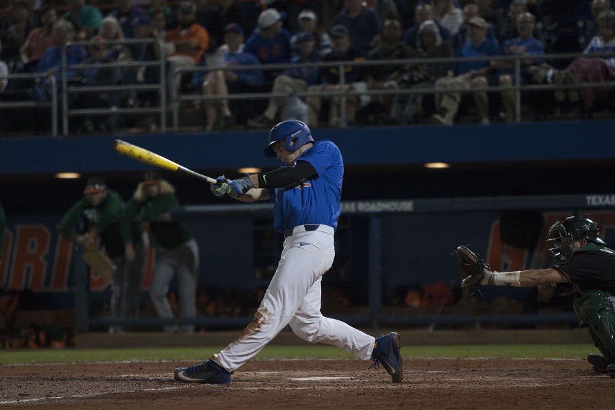 UF first baseman JJ Schwarz swings during Florida's 2-0 win against Miami on Feb. 25, 2017, at McKethan Stadium.