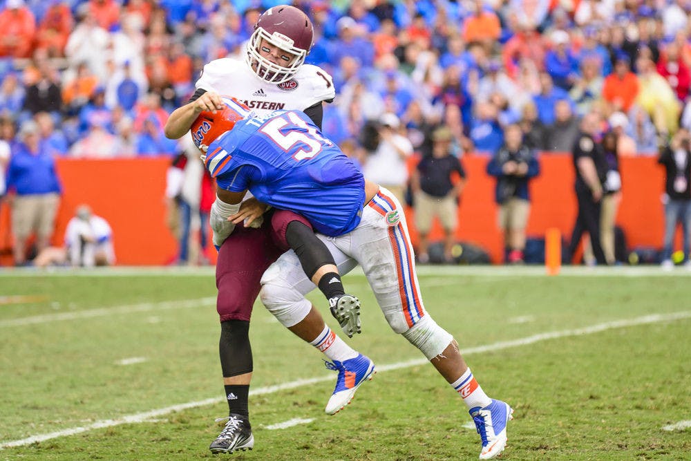 Mike Taylor makes a tackle during Florida's win against Eastern Kentucky on Saturday at Ben Hill Griffin Stadium.