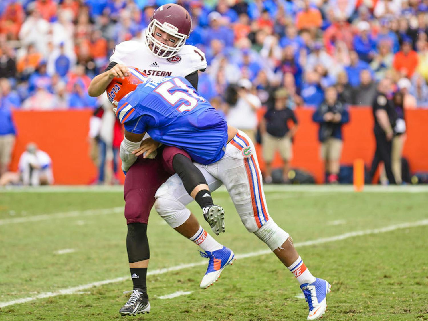 Mike Taylor makes a tackle during Florida's win against Eastern Kentucky on Saturday at Ben Hill Griffin Stadium.