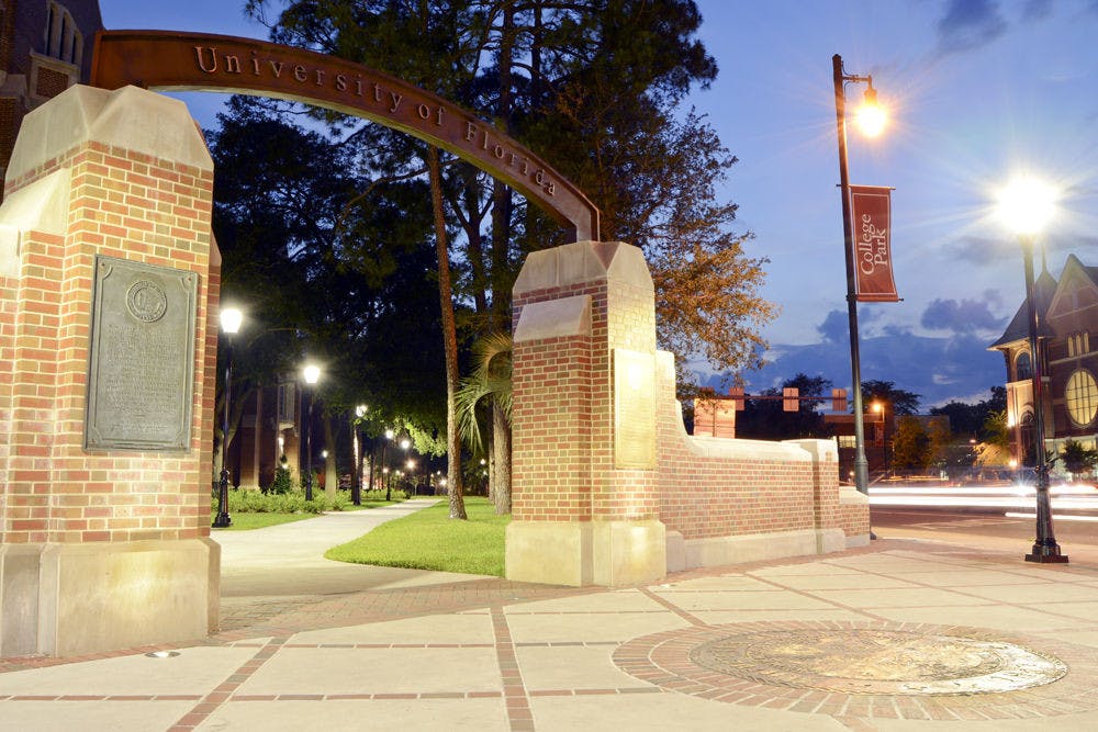 <p>In this long exposure photo, cars drive past the arch near Heavener Hall overlooking West University Avenue and Southwest 13th Street. Summer A classes began yesterday and will run through June 19.</p>