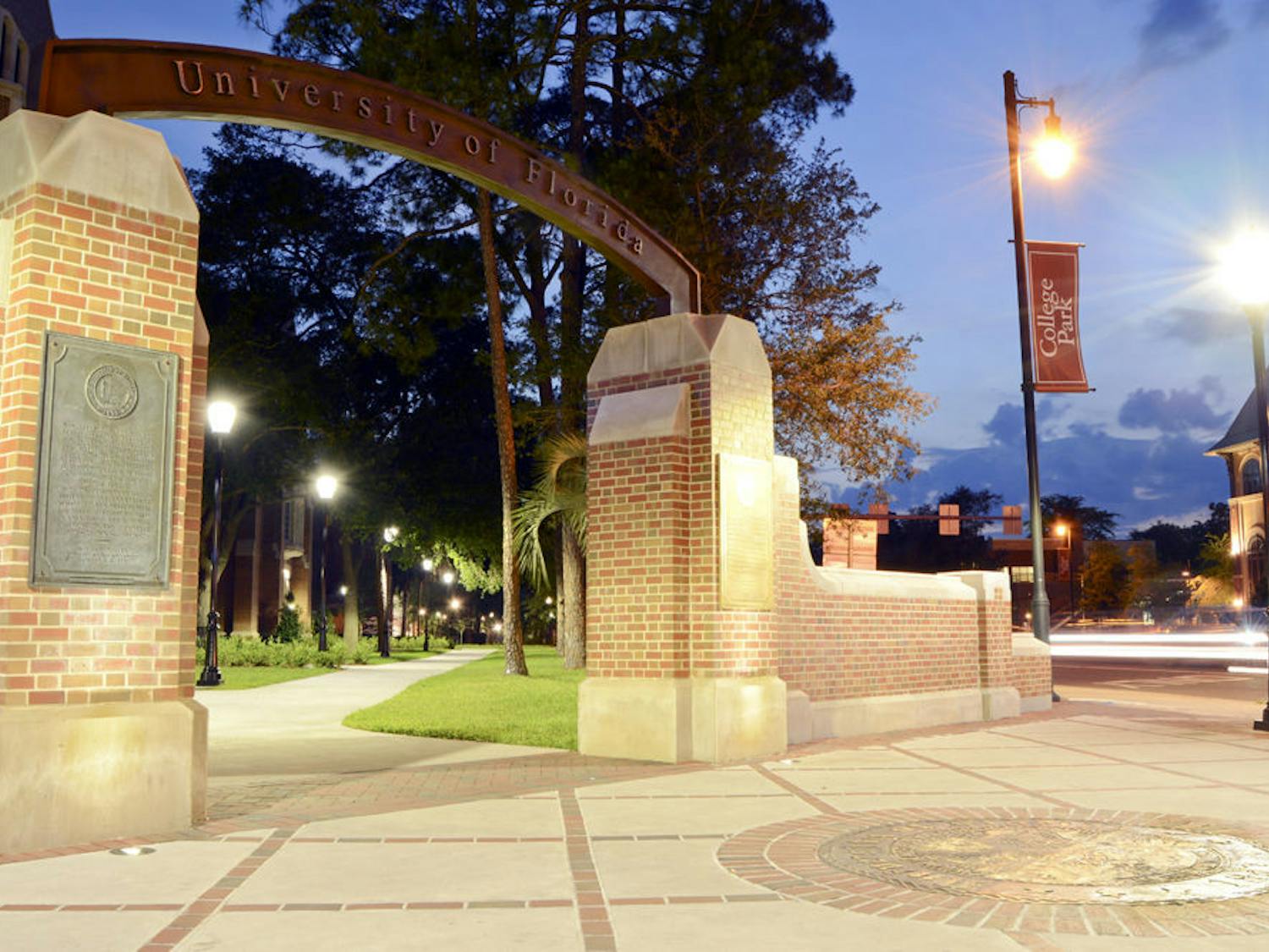 In this long exposure photo, cars drive past the arch near Heavener Hall overlooking West University Avenue and Southwest 13th Street. Summer A classes began yesterday and will run through June 19.