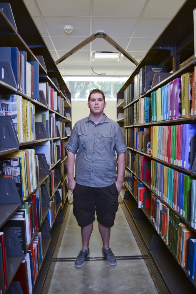Brandon Fantozzi, a 20-year-old UF anthropology sophomore enrolled in Innovation Academy, poses for a photo on the first floor of Library West. A student on the pre-medicine track to be a physician’s assistant, Fantozzi said he was concerned about falling behind because none of his critical tracking courses are offered during the fall.