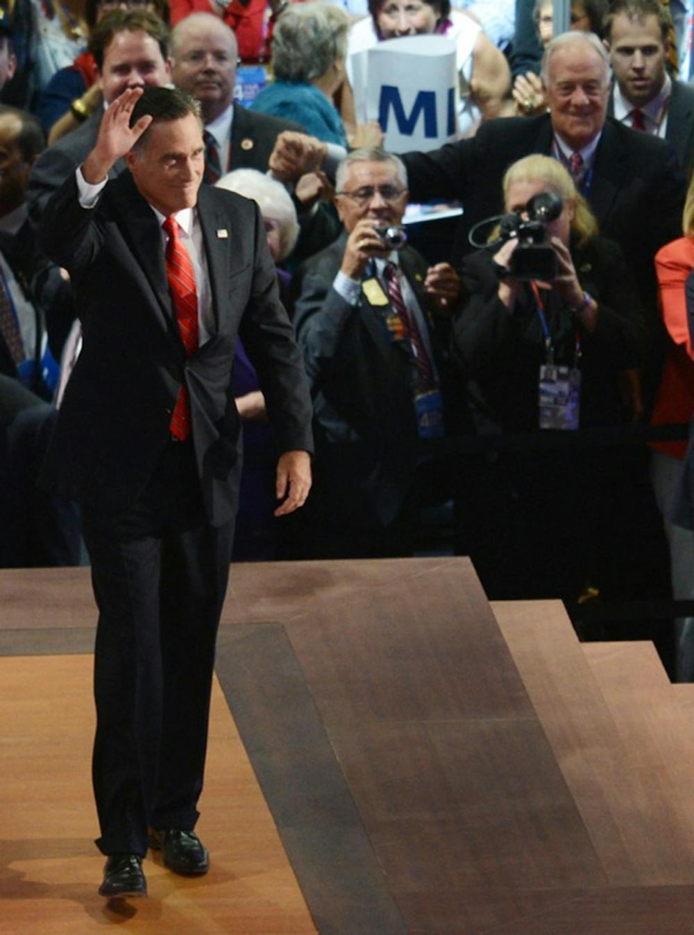 <p>Republican presidential candidate Mitt Romney waves at the Republican National Convention at the Tampa Bay Times Forum on Thursday.</p>