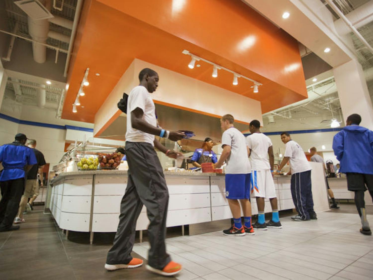 Customers peruse and eat at Gator Corner Dining Center. It reopened Monday after a $2.5 million renovation.