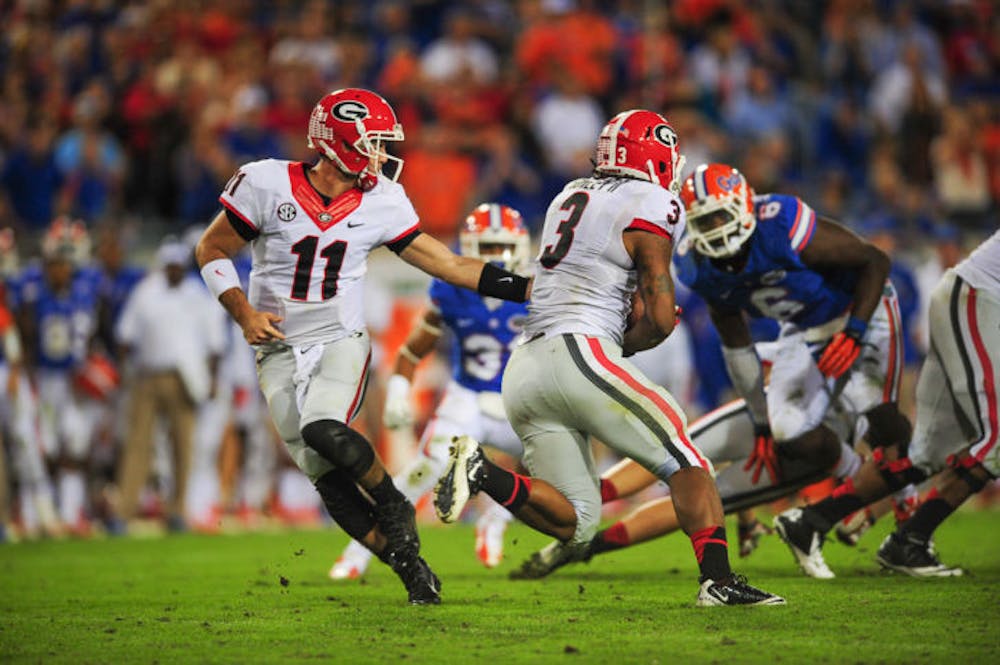 <p>Georgia quarterback Aaron Murray (11) hands off the football to running back Todd Gurley (3) during Florida’s 23-20 loss to Georgia on Saturday at EverBank field in Jacksonville. Gurley rushed for 100 yards against UF.</p>