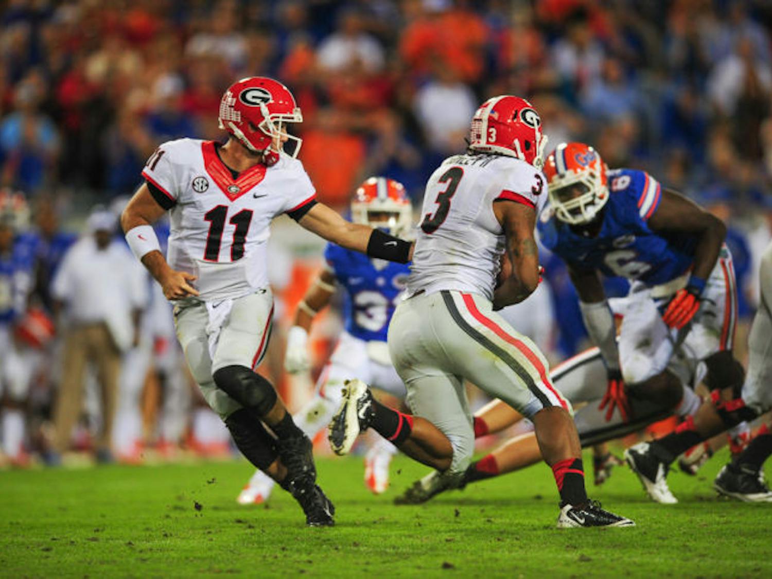Georgia quarterback Aaron Murray (11) hands off the football to running back Todd Gurley (3) during Florida’s 23-20 loss to Georgia on Saturday at EverBank field in Jacksonville. Gurley rushed for 100 yards against UF.