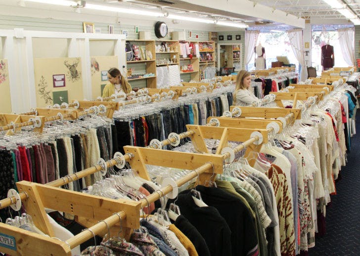 Employees organize the aisles of Urban Thread, located at 1512 NW 13th St., Wednesday afternoon.