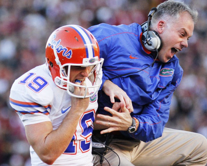 Kicker Caleb Sturgis (19) celebrates with former special teams and current defensive coordinator DJ Durkin during Florida’s 37-26 win against Florida State on Nov. 24 in Tallahassee.