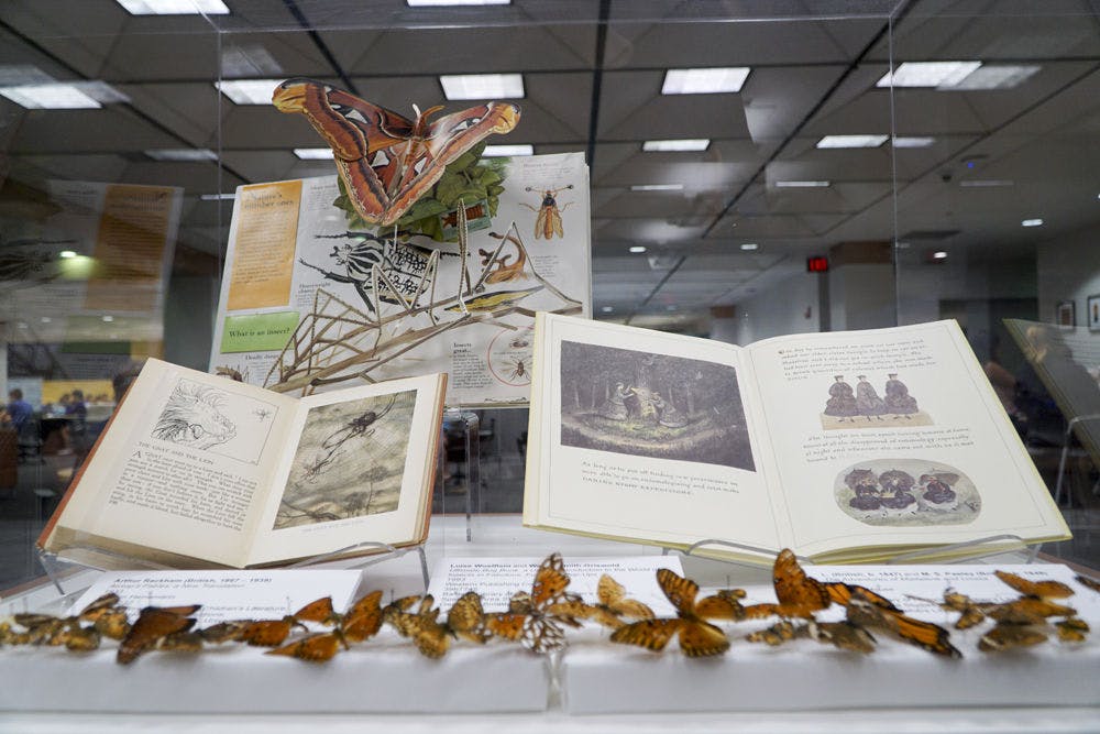 <p>A collection of Aesop’s Fables lays open to the fable of the gnat and the lion inside Marston Science Library as part of a campus-wide exhibit titled “Capturing Nature: The Insect World in Art.” The exhibit shows how insects are important to different areas of study, including calligraphy, children’s literature and jewelry.</p>