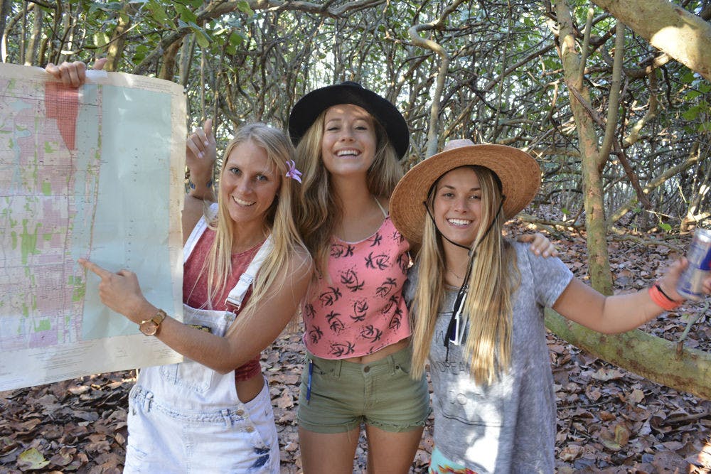 <p>From left: Brett Walker, 24, Sky Smith, 22 and Dixie Smith, 21, pose for their team photo for RedBull’s “Can You Make It?” contest which tasks teams to a race across Europe with nothing but cans of the energy drink. The students are a part of UF’s Surf Club and entering alongside another team of three in the same club.</p>