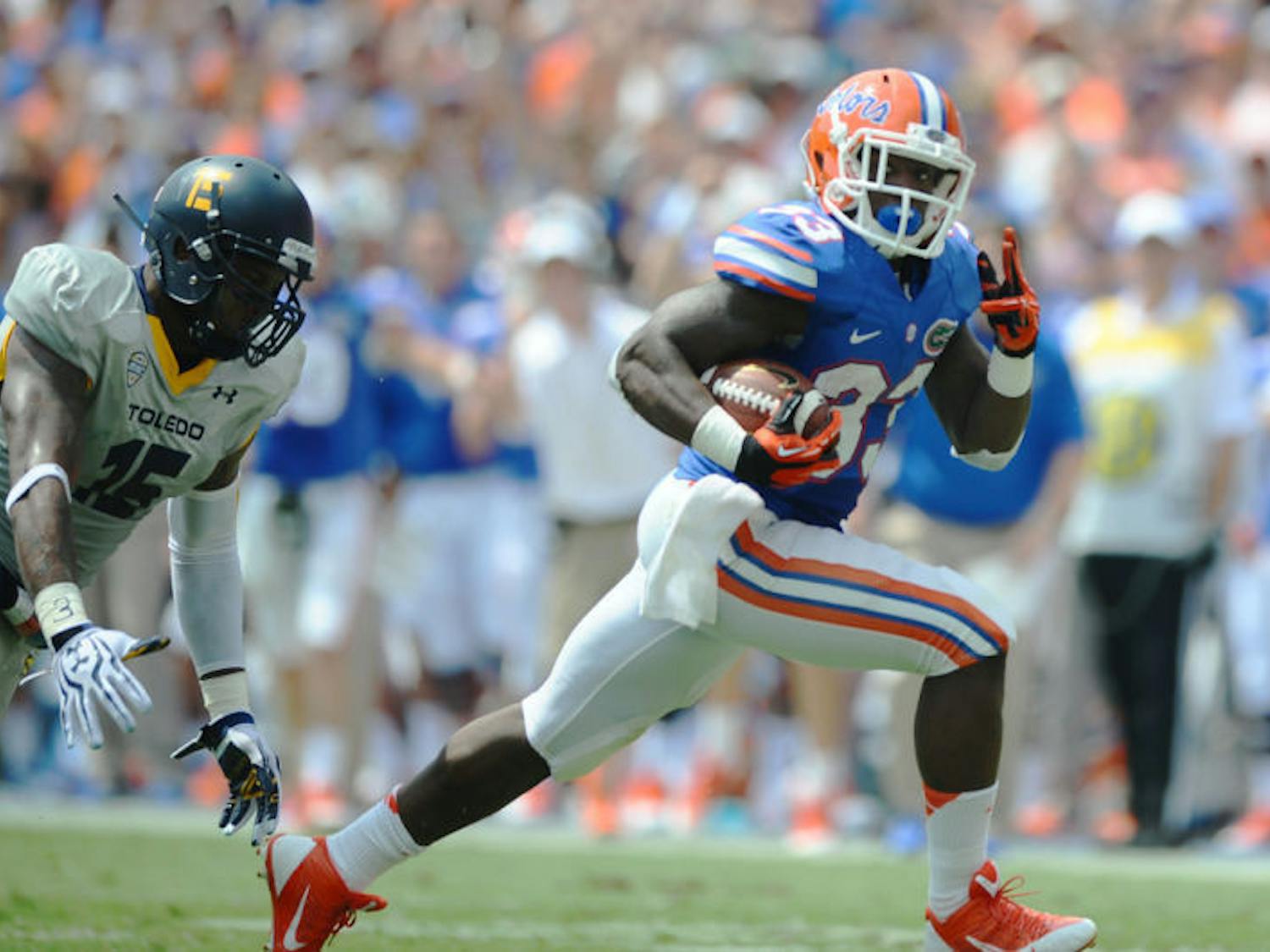 Mack Brown runs down the field after catching a pass during Florida’s 24-6 victory against Toledo on Saturday in Ben Hill Griffin Stadium. Brown rushed for 112 yards and two touchdowns in the win.