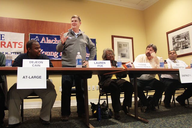 Lauren Poe, a Gainesville City Commission At-Large 1 candidate, speaks to a crowd of about 50 people, 25 of whom were students, at a forum Monday night in the Reitz Union.
