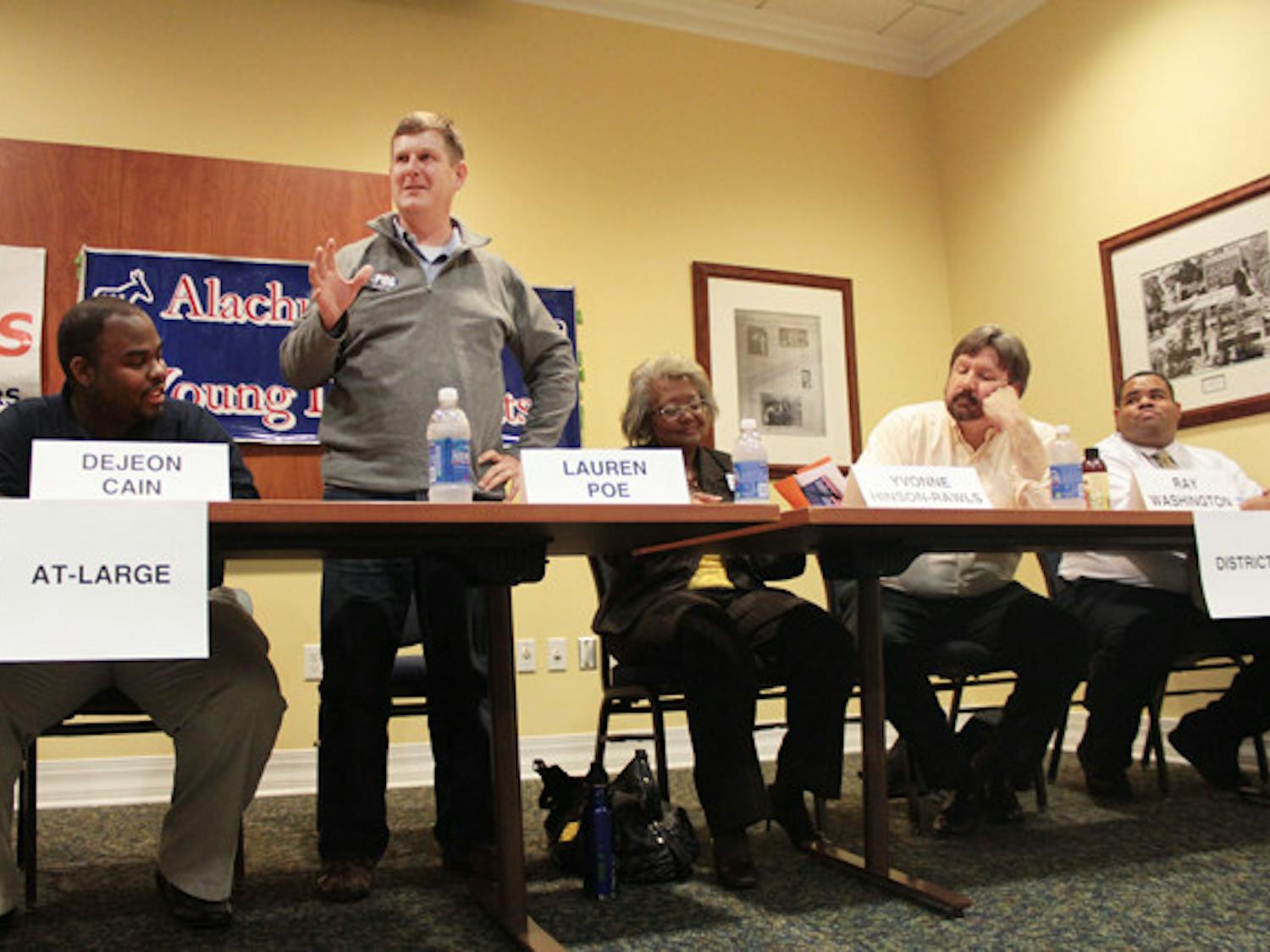 Lauren Poe, a Gainesville City Commission At-Large 1 candidate, speaks to a crowd of about 50 people, 25 of whom were students, at a forum Monday night in the Reitz Union.