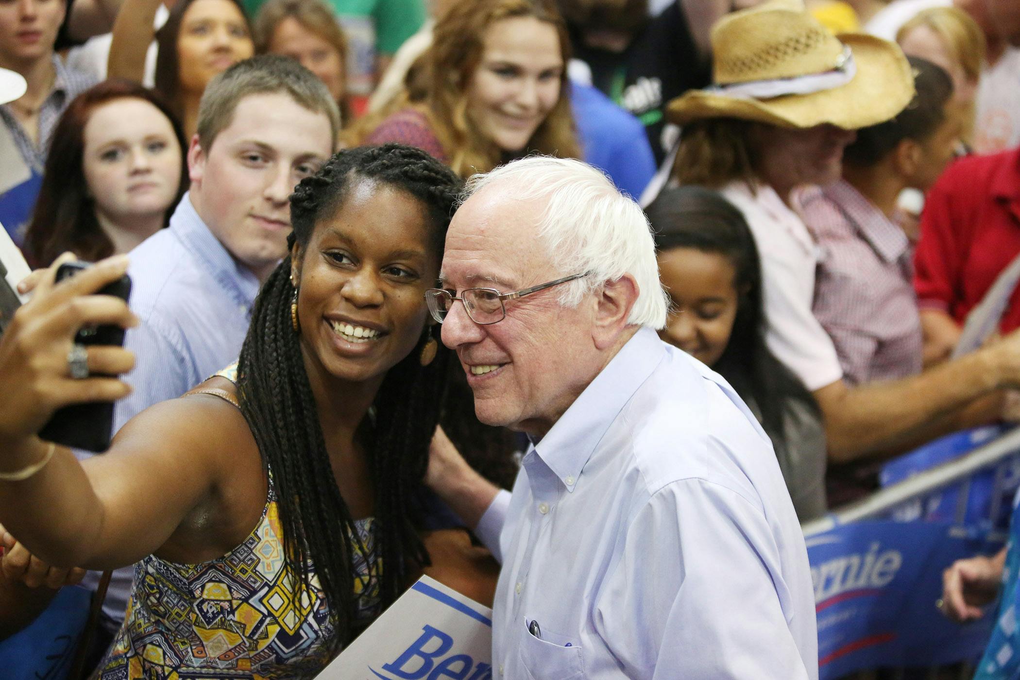 Democratic presidential candidate Sen. Bernie Sanders, I-Vt., right, poses for a photo at a rally, Sunday, July 26, 2015, in Kenner, Louisiana.