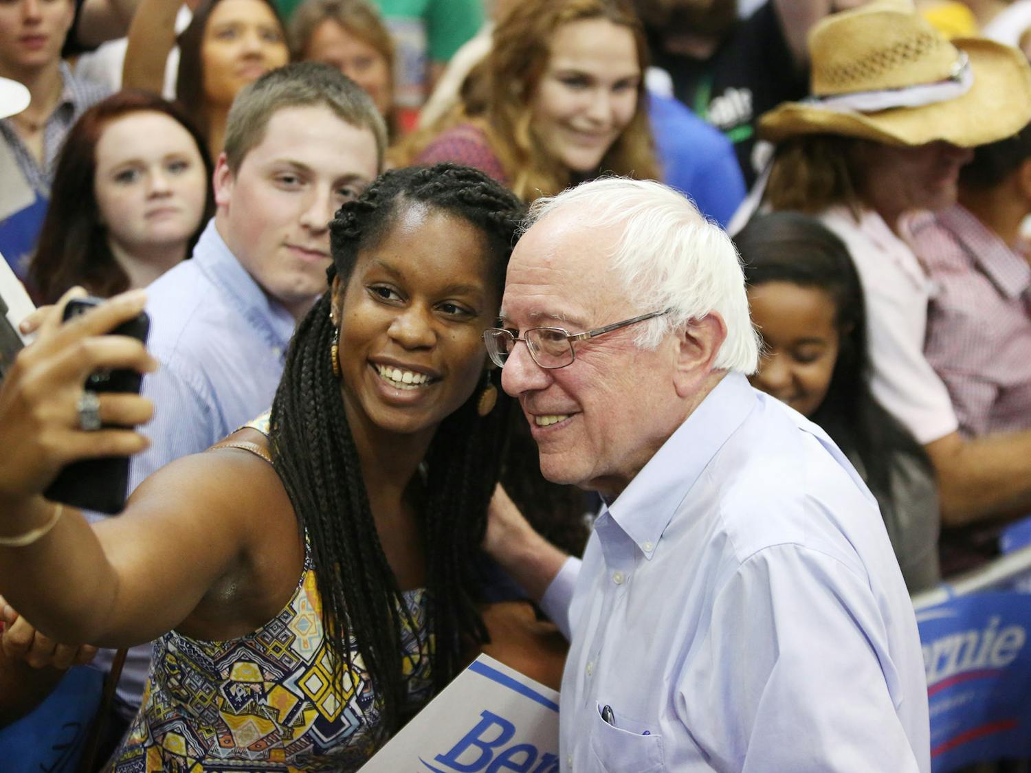 Democratic presidential candidate Sen. Bernie Sanders, I-Vt., right, poses for a photo at a rally, Sunday, July 26, 2015, in Kenner, Louisiana.