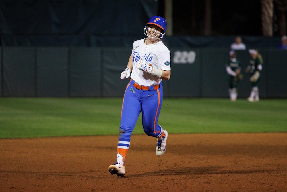 Florida Gators infielder Kenleigh Cahalan rounds the bases after hitting a grand slam during the third inning of an NCAA softball game against Jacksonville, Wednesday, Feb. 11, 2026, in Gainesville, Fla.