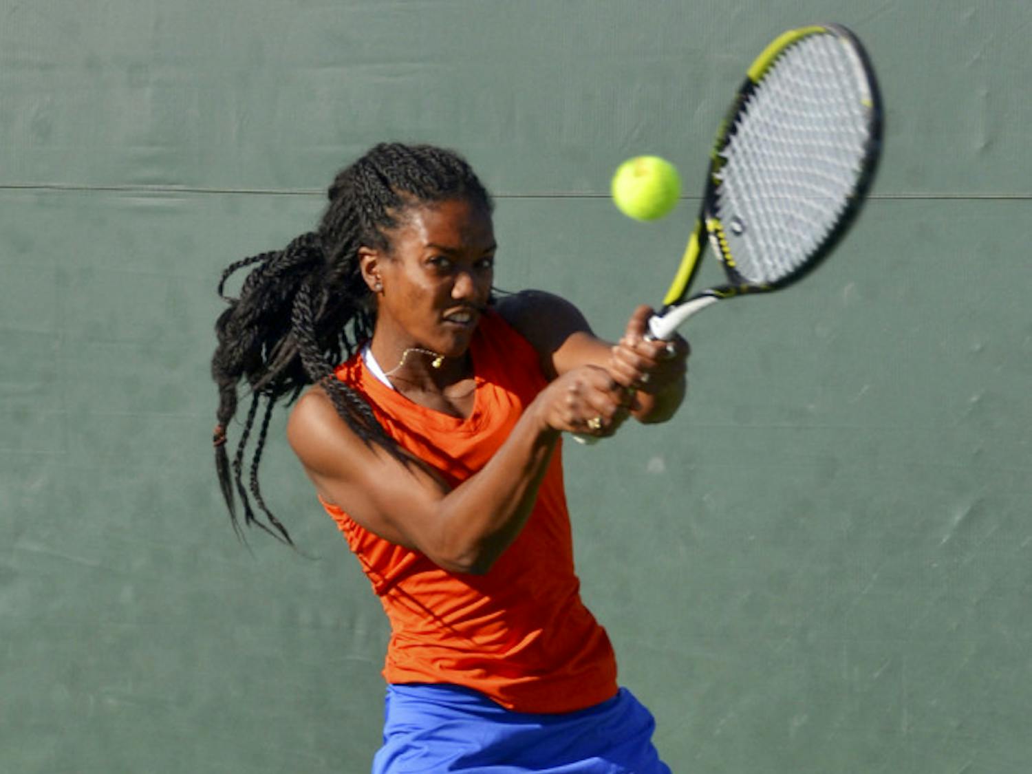 Brianna Morgan hits a two-handed backhand during Florida's 4-0 win against Elon on Saturday at the Ring Tennis Complex.