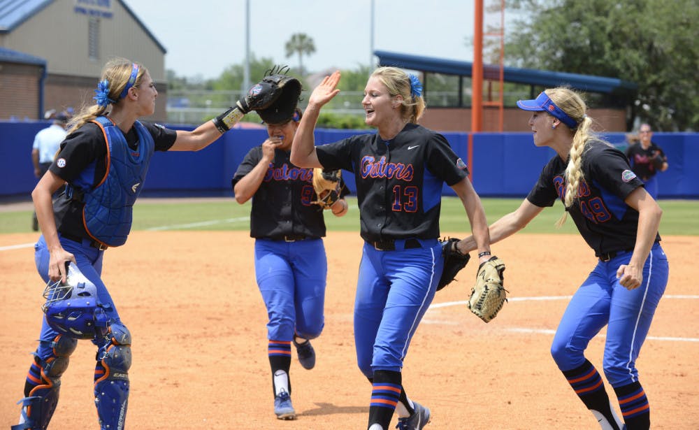 <p>Junior pitcher Hannah Rogers (13) celebrates with her teammates following Florida’s 2-0 win against South Florida on Sunday afternoon at Katie Seashole Pressly Stadium. </p>