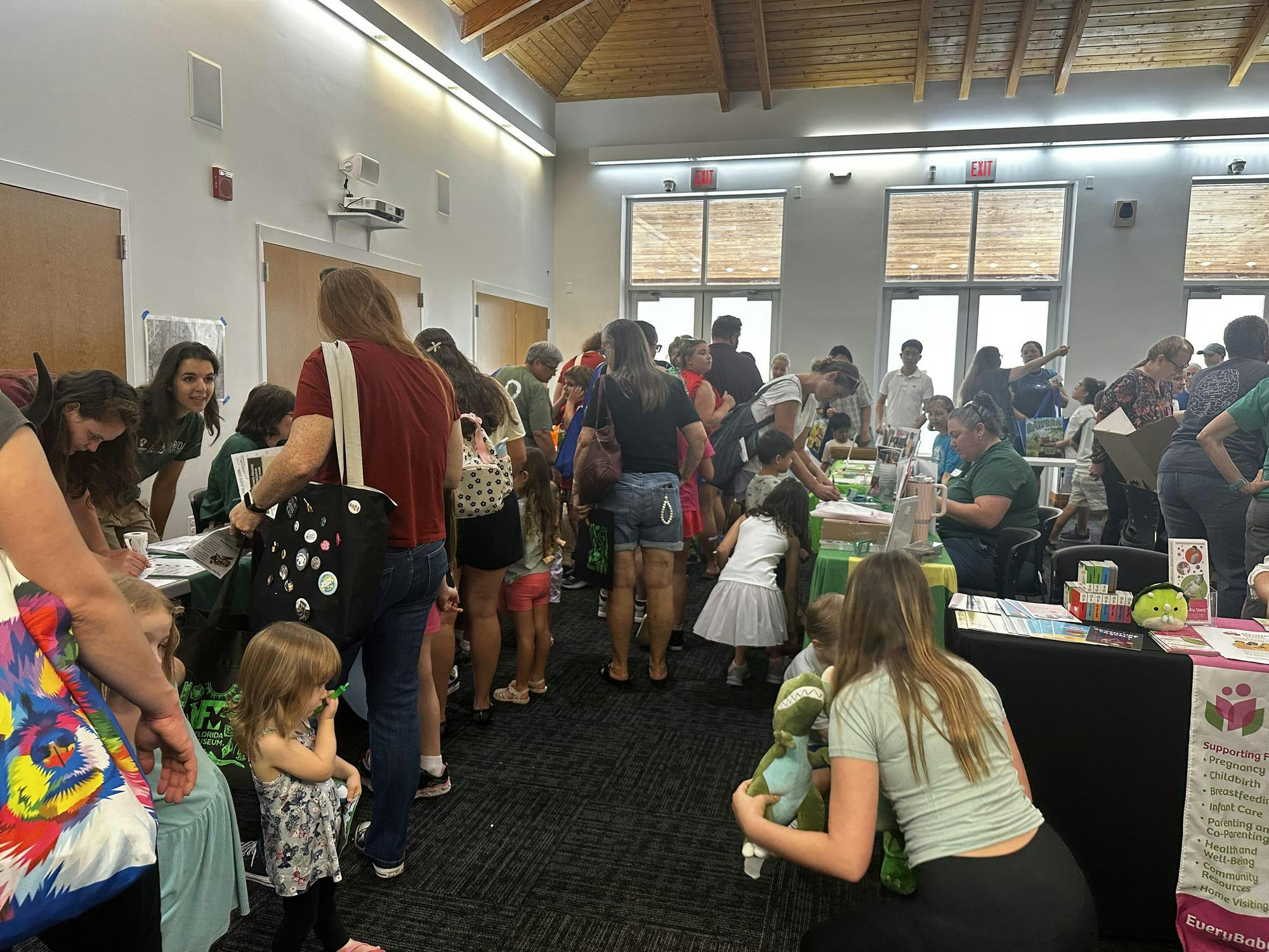 Attendees gather during the “Rawrrr Into Reading” event at the Tower Road Branch Library, Saturday, June 6, 2026, in Gainesville, Fla.