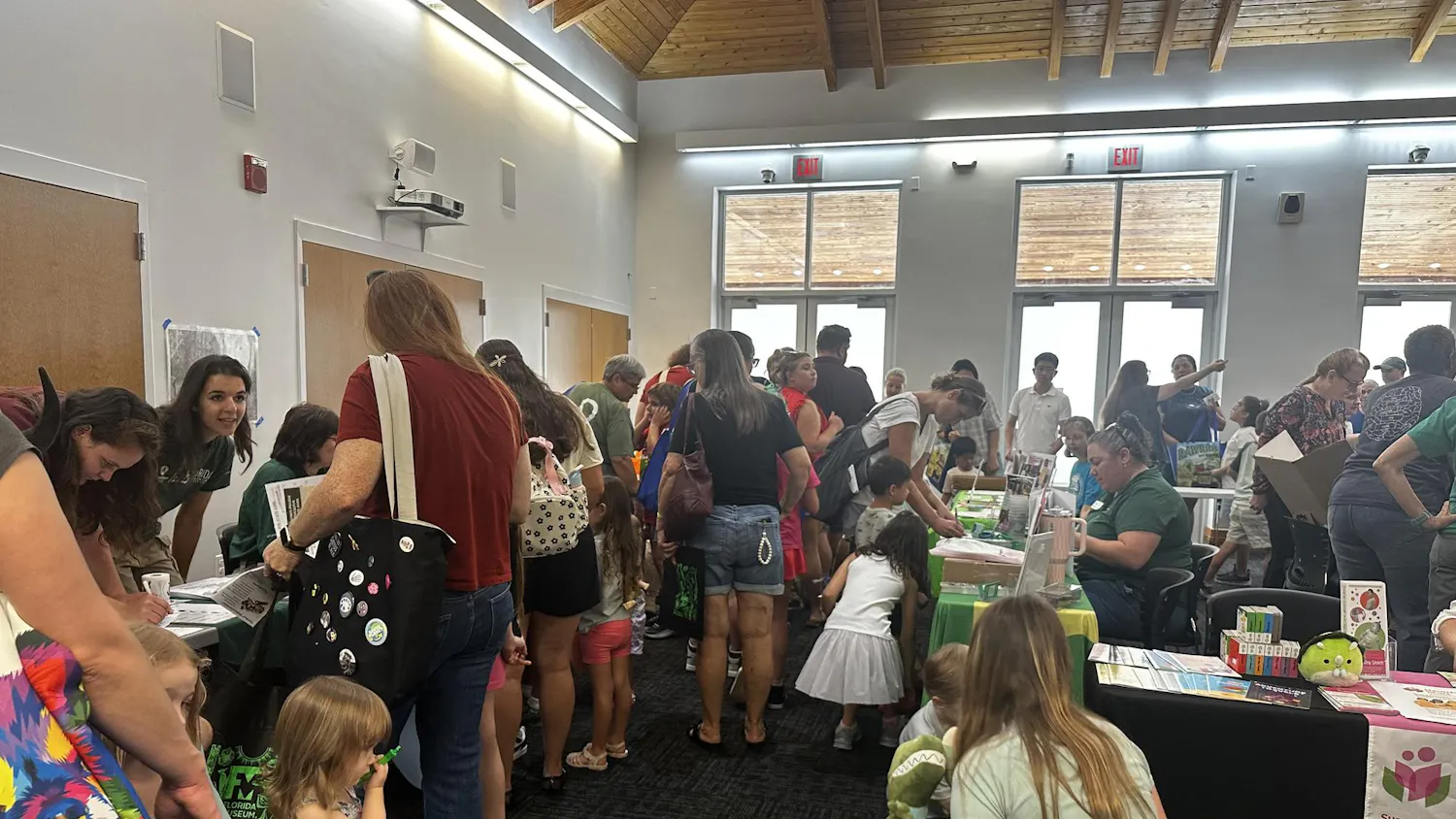Attendees gather during the “Rawrrr Into Reading” event at the Tower Road Branch Library, Saturday, June 6, 2026, in Gainesville, Fla.