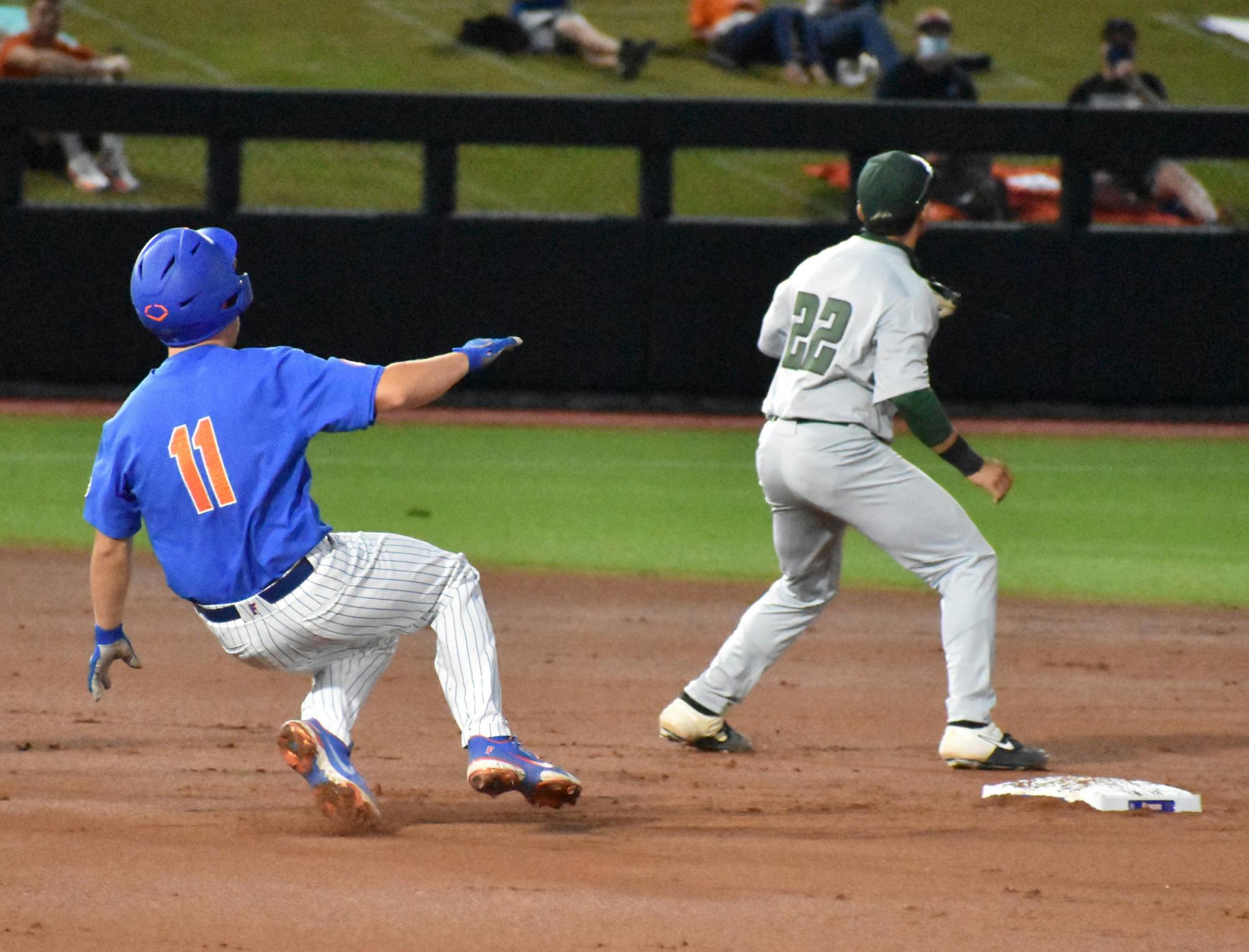 Florida catcher Nathan Hickey slides into second base March 13 against Jacksonville University. Florida takes on USF Friday in the first round of the NCAA Regional.