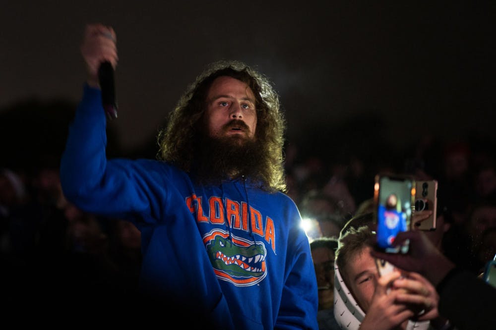 Kevin Saurer, of the duo Hippy Sabotage, stands among the crowd Friday night at UF Student Government Production’s Quinn XCII and Hippie Sabotage concert.