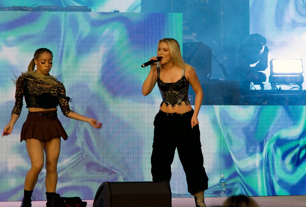 <p>Zara Larsson, a Swedish pop singer, dances alongside her performers at Flavet Field for a concert put on by Student Government Productions Wednesday, March 22, 2023.</p>
