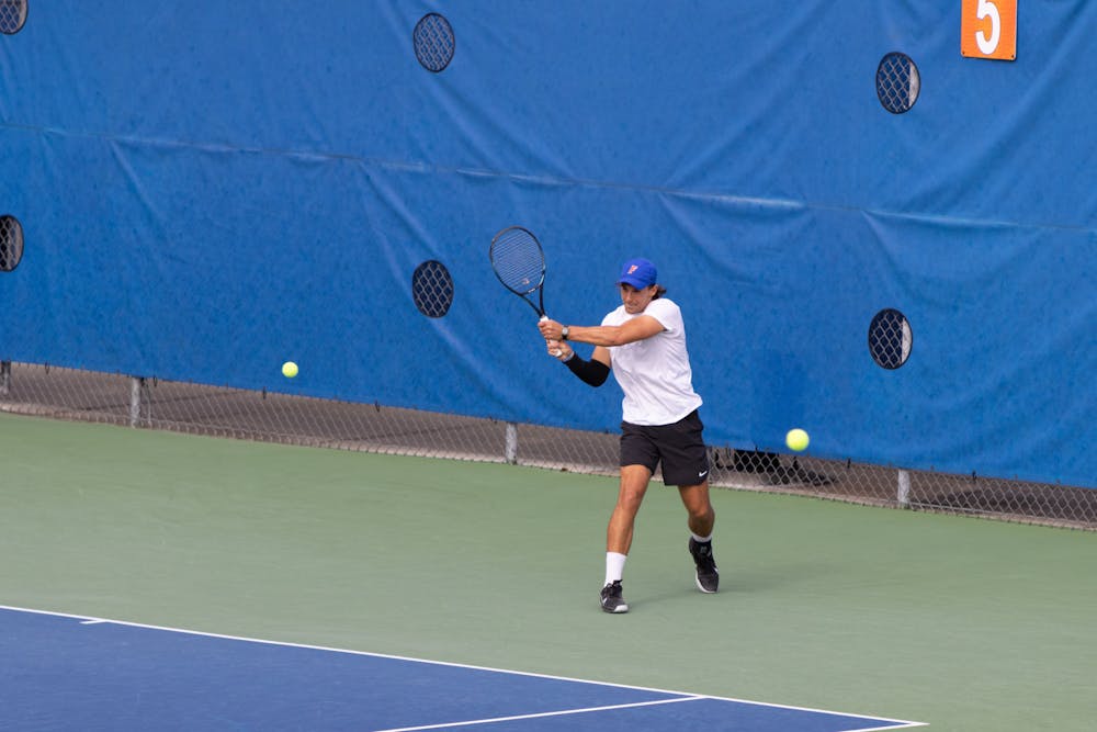 Florida graduate student JanMagnus Johnson rips a backhand in the Gators’ 7-0 win against The Citadel on Friday, Jan. 19, 2024.
